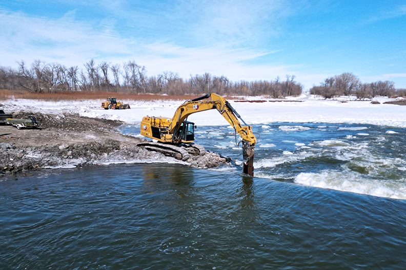 Flying drone around the demolition of a dam