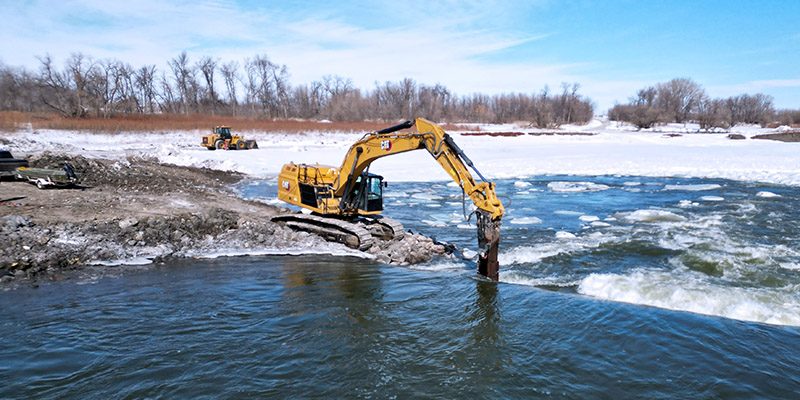 Flying drone around the demolition of a dam